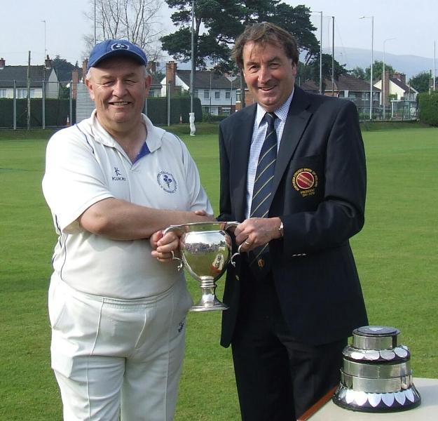 Ivan McCombe receives the Intermediate Cup from NCU President Chris Harte